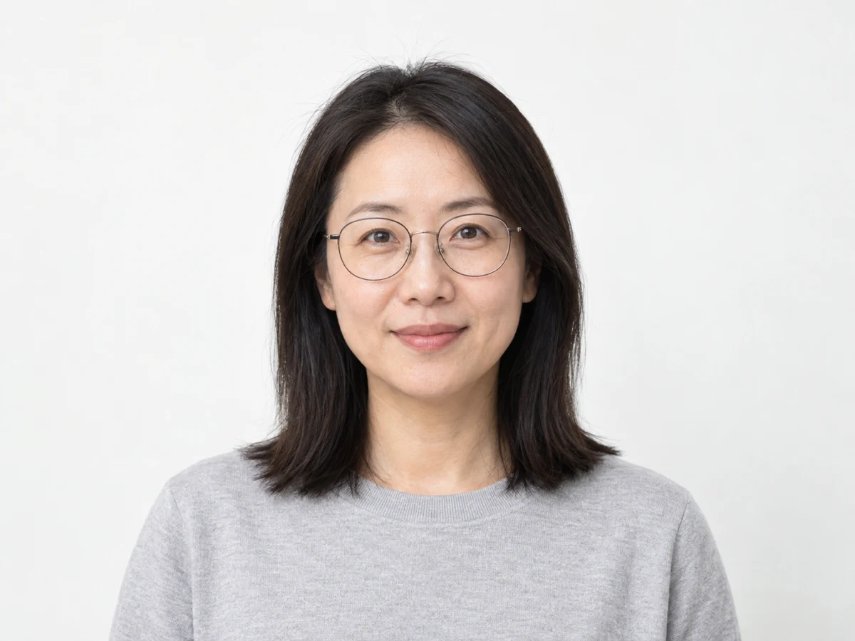 Clean minimal AI headshot of a professional on a bright seamless backdrop